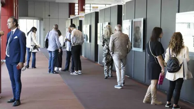 Visitors walking along a gallery of Il Tarì Gold Centre.