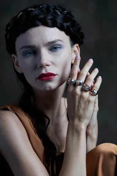 Model wearing silver rings with hand-carved shell cameos, Musical collection