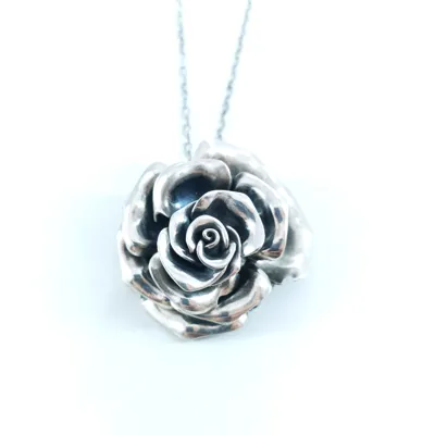 Sculpted silver rose pendant on a chain, Bouquet Noir collection