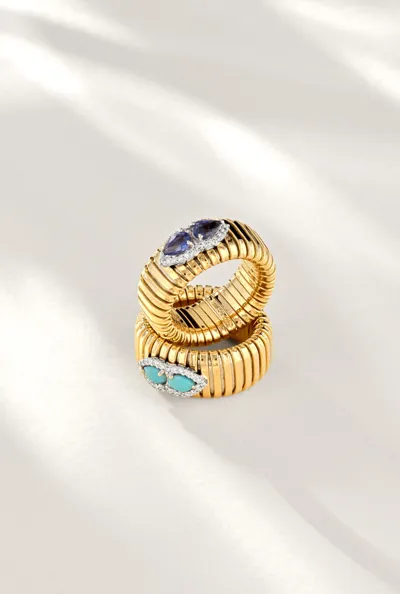 Two yellow gold Tubogas rings set with blue and turquoise gemstones