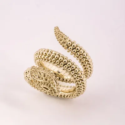 Gold snake wrap ring with a beaded body and a head with empty stone settings