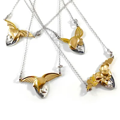 Four winged pendants in silver and bronze on chains, Oneiroi collection