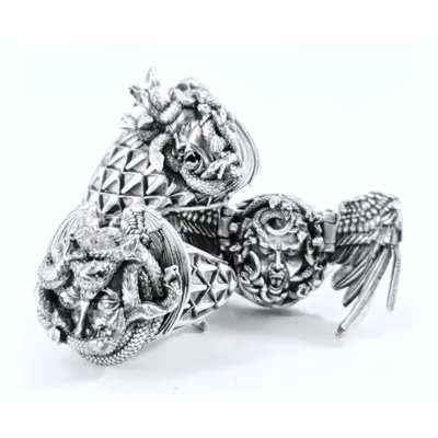 Sculpted silver rings with Gorgon faces, snakes and wings, Gorgona collection