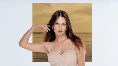 Model wearing a diamond ring, bracelet, earrings and pendant, Blossom collection