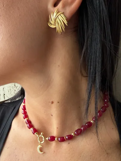 Model wearing a 925 sterling silver necklace with a zirconia charm and silver earrings