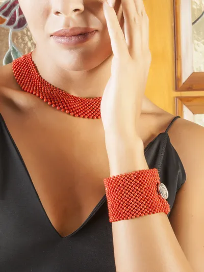 Model wearing a coral and silver bracelet and necklace, Coral Texture line