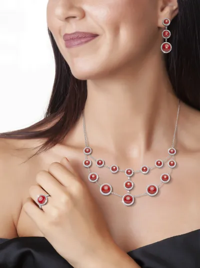 Model wearing coral, white gold and diamond drop earrings, necklace and ring, Starry Sky line