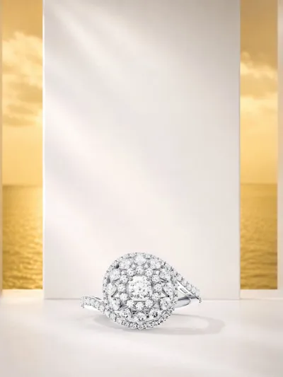 Diamond spiral ring from the Snail collection in a sunlit seaside setting