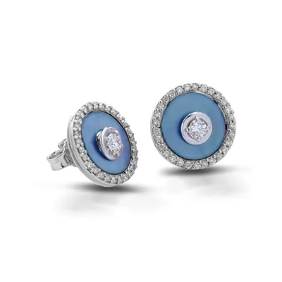 Stud earrings with light blue discs and a central diamond in a diamond halo, in 18kt white gold