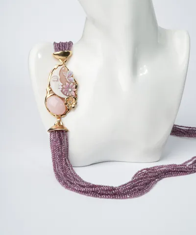 Violet multi-strand zirconia necklace with an enamelled cameo and pink opal