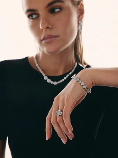 Sogni – Model wearing a Materia Collection pavé necklace, bracelet, ring and drop earrings, brass-based alloy with 18-karat gold plating