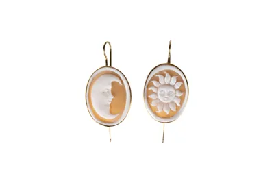 Oval shell cameo earrings carved with a moon and a sun, set in 18kt gold
