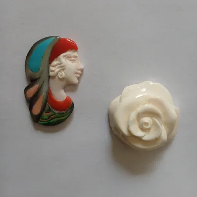 Hand-carved natural stone mosaic and a pink shell rose