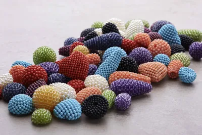Woven beaded elements in many colours