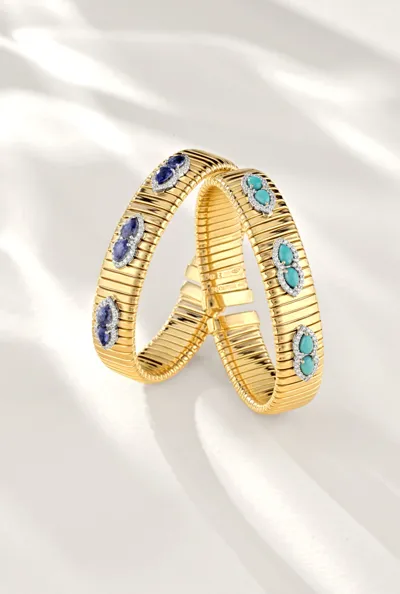 Two yellow gold Tubogas bracelets set with oval blue and turquoise gemstones