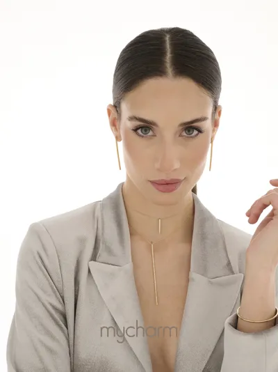 Model wearing diamond bar necklaces and earrings in 18kt gold, MyCharm