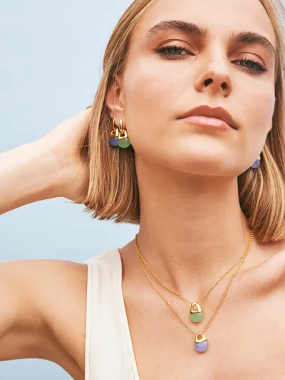 Sogni – Model wearing Gemme Collection hoop earrings and layered pendants with green and lilac stones, silver with 18-karat gold plating