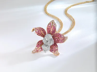 Orchid pendant with pink gemstones and diamonds on a gold chain