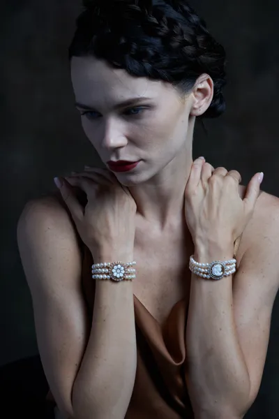 Model wearing bracelets with natural pearls and hand-carved shell cameos, Ballet collection