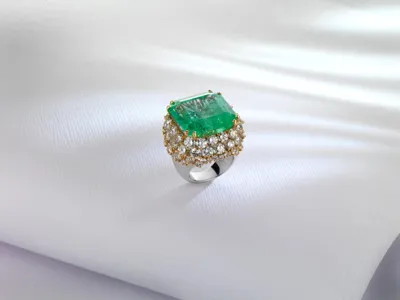Ring with a square green stone surrounded by diamonds, in yellow gold